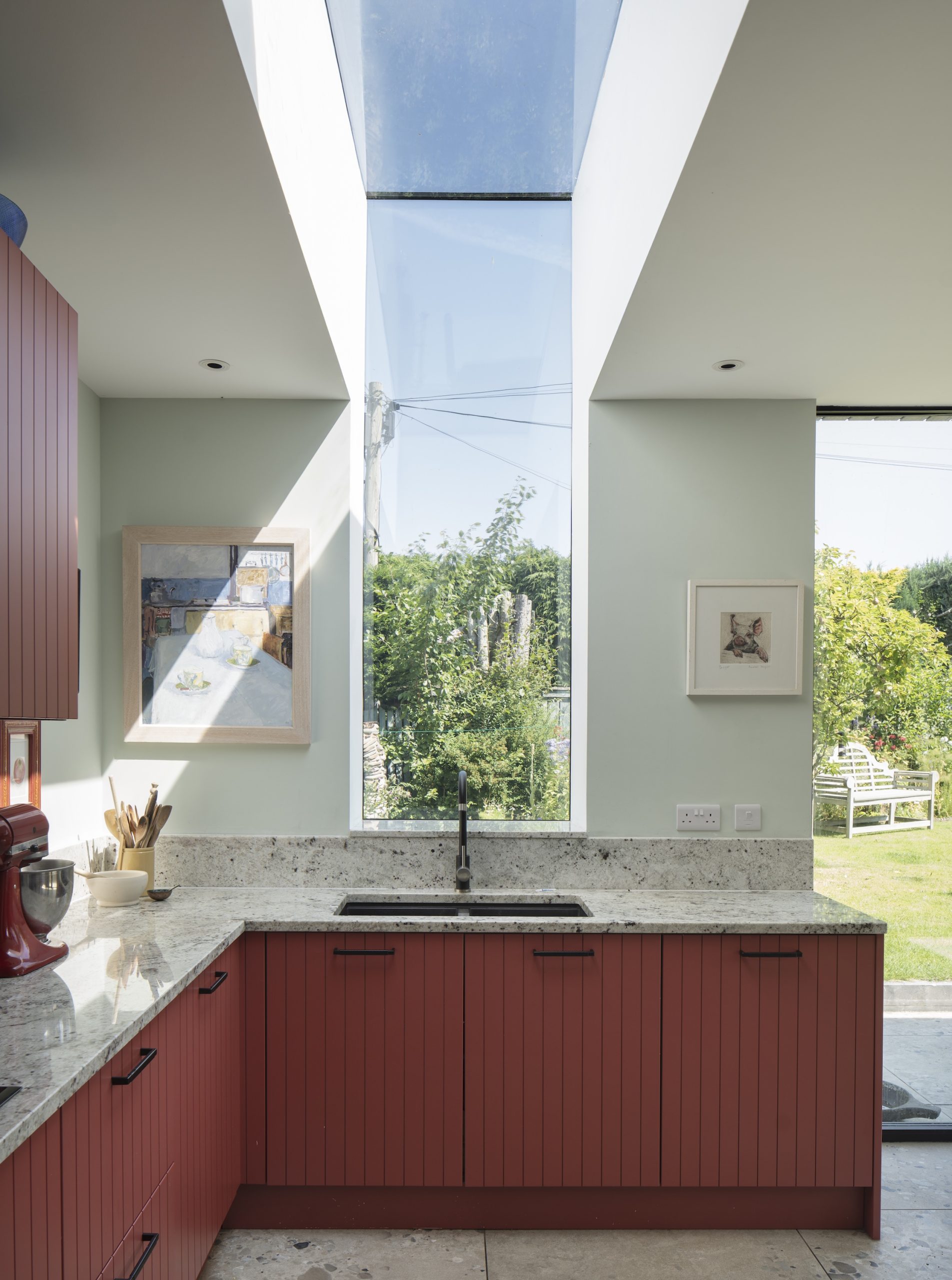 Kitchen in Bamboozle by Farrow & Ball with frameless window & rooflight