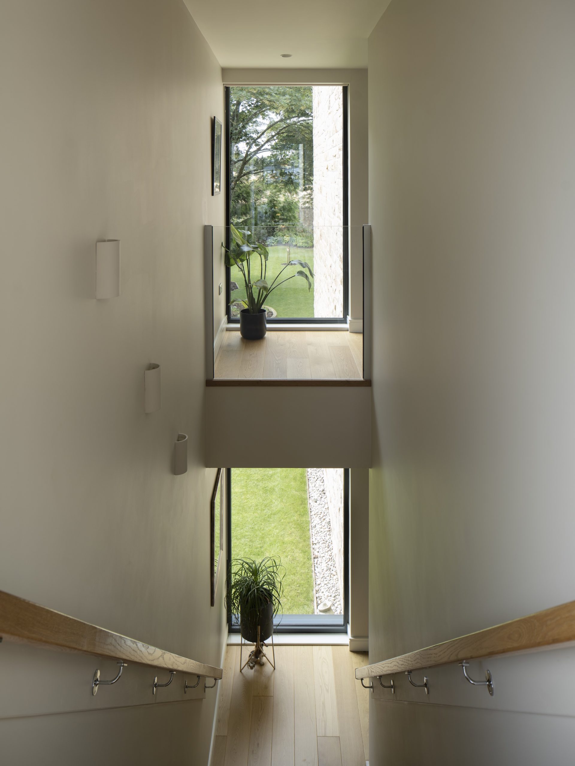 Internal balcony overlooking oak stair and garden