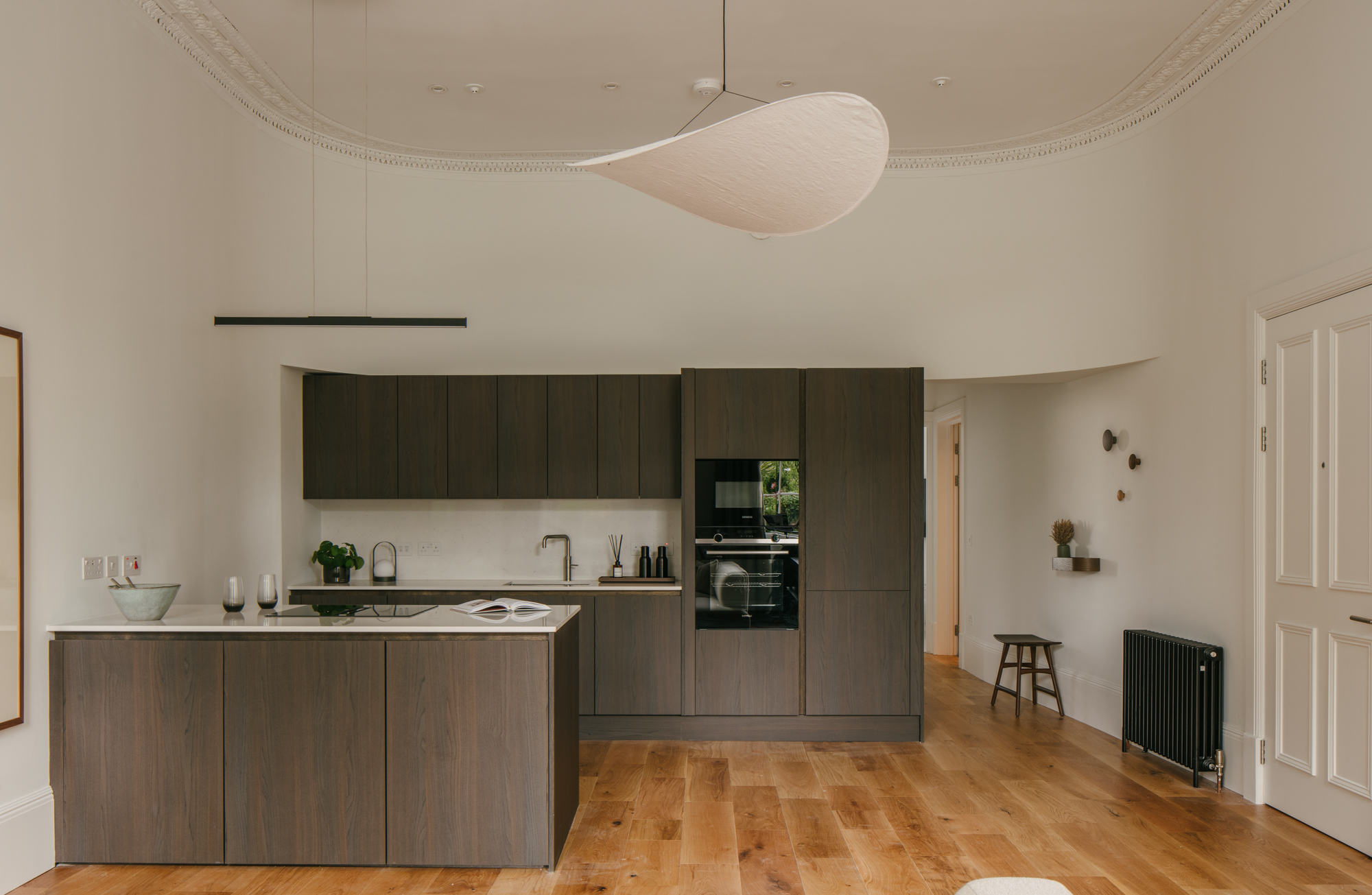 Smoked oak kitchen with timber oak floor at elegant townhouse